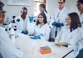 Students, research and girl question in laboratory, class and studying healthcare. Scientist, young researchers or lecture for medical innovation, scientific methods and woman raise hand or education